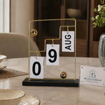 Premium gold perpetual desk calendar with black base